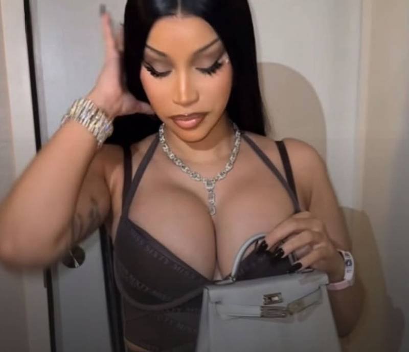 Cardi B carrying a metallic Hermès Mini Kelly bag